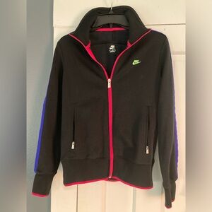 Nike sportswear size medium with neon color trim.